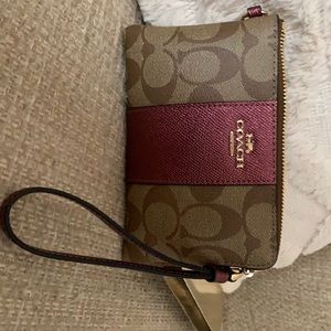 Coach wristlet with charms